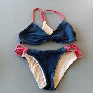 Tan, navy, and red reversible bikini